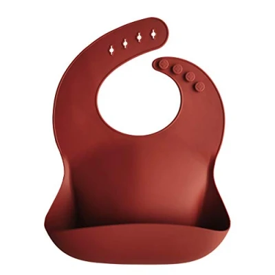 Afbeelding van Mushie Siliconen Baby Slabbetje met Opvangbakje Raw Sienna BPA ftalaatvrij afwasbaar