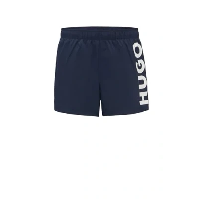 Afbeelding van HUGO BOSS heren Abas zwemshorts met steekzakken en logo in de kleur Donkerblauw, maat: XL