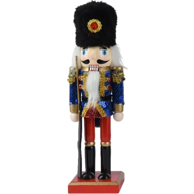 Afbeelding van Vurenhouten Notenkraker met pailletten en geweer 25 cm Blauw
