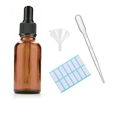 Afbeelding van 1 x amberkleurige glazen druppelfles met zwarte doppen, meetpipet, trechter en etiketten; druppelflesjes van 30 ml voor navulbare etherische olie pipet