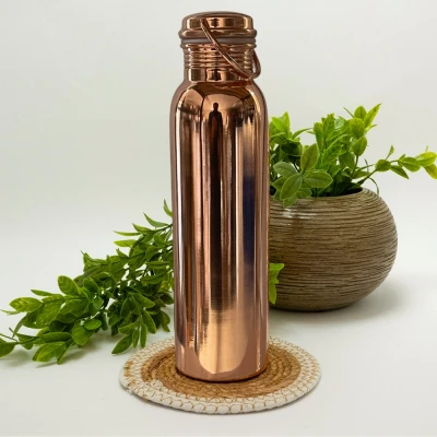 Afbeelding van Puur koperen waterfles gepolijst met handgreep ± 950 ml (330 gr. zware uitvoering)