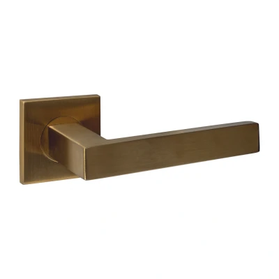 Afbeelding van Intersteel Deurkruk Q 05 op rozet verdekt 53x53x6mm PVD messing mat