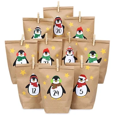 Afbeelding van Papierdrachen DIY adventskalender set van kraftpapier pinguïns om op te plakken met 24 bruine papieren zakjes zelf vullen en maken Kerstmis 2021
