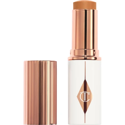Afbeelding van Charlotte Tilbury Unreal Skin Sheer Glow Tint Hydrating Foundation Stick 12 Tan 9 Gram