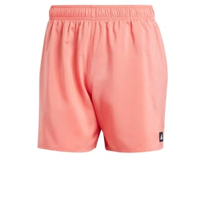 Afbeelding van Adidas heren Solid CLX zwemshorts met steekzakken in de kleur Koraal, maat: M