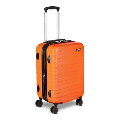 Image de Amazon Basics Valise rigide en ABS à 4 roulettes, format cabine approuvé par la plupart des compagnies aériennes, 55 cm, orange brûlé