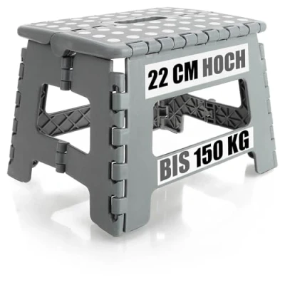 Afbeelding van COM FOUR® Opvouwbaar opstapje met rubberen noppen Draagbaar krukje een draagvermogen tot 150 kg opstapkrukje voor thuis en op kantoor (31x22x22cm grijs 01 stuk)