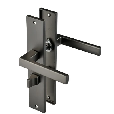 Afbeelding van Ostiumhome Deurbeslag Deurklink op schild met WC Slot 64 mm Gun Metal Fano