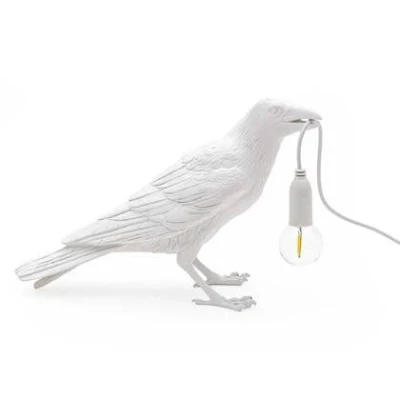 Afbeelding van Seletti Bird Waiting tafellamp buiten wit
