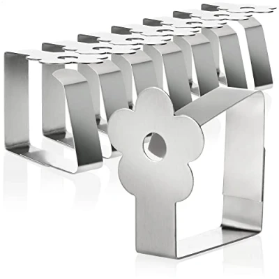Afbeelding van COM four® 8x premium tafelkleedclips van roestvrij staal doekhouder voor tafellinnen tafelclips binnen en buiten met decoratie moderne tafelklemmen metalen clips (08 stuks/bloem)