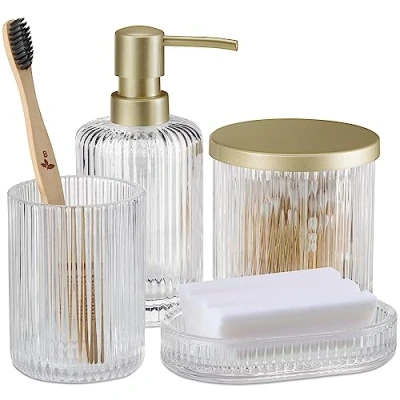 Afbeelding van Navaris glazen badkamer accessoires set Zeepdispenser zeepbakje beker en pot met deksel 4 delig Geribbeld glas Transparant/goudkleurig